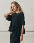 OVERSIZED RUFFLE PEPLUM TEE IN TRUE BLACK