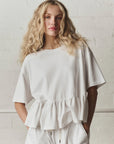 OVERSIZED RUFFLE PEPLUM TEE IN TRUE WHITE