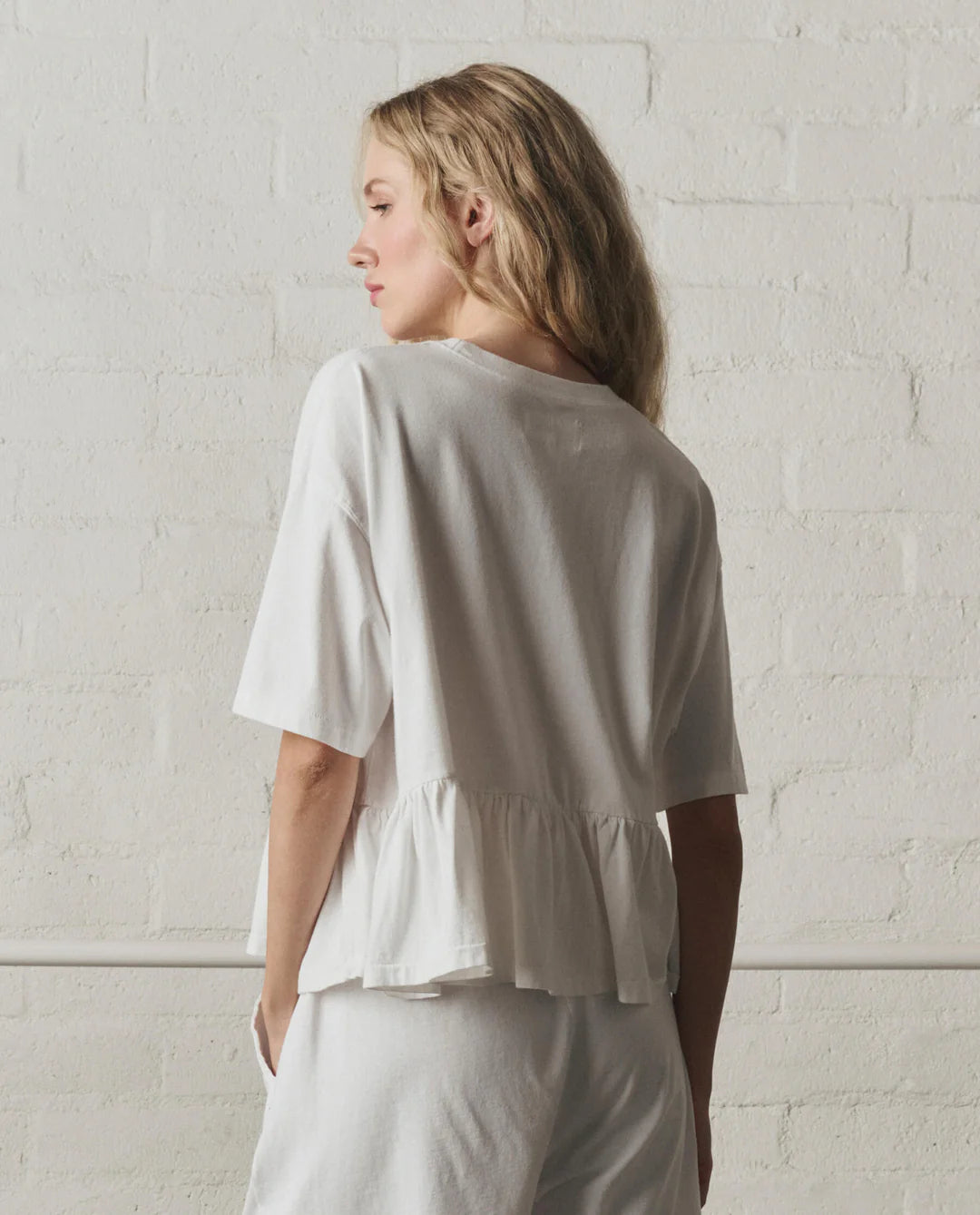 OVERSIZED RUFFLE PEPLUM TEE IN TRUE WHITE