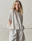 OVERSIZED RUFFLE PEPLUM TEE IN TRUE WHITE